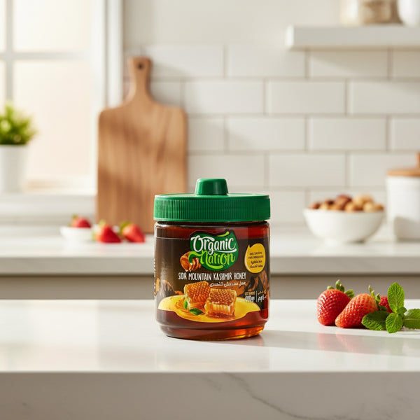 Jar of Organic Nation Sidr Mountain Kashmir Honey with green lid on a white background